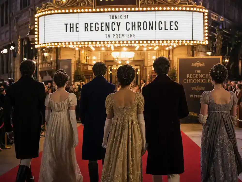 Bridgerton season 4 cast and new characters guide ensemble — period TV drama cast silhouettes from behind walking red carpet toward theater marquee at premiere night
