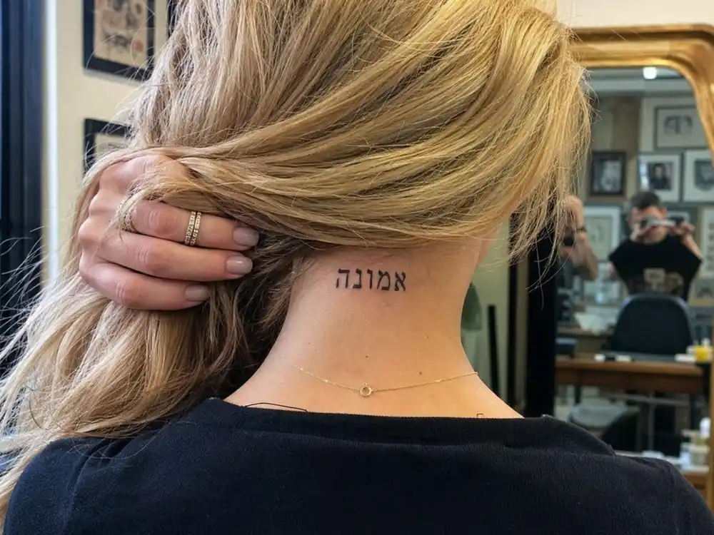 Britney Spears tattoos and their meanings Hebrew neck — Kabbalah Mem Hey Shin healing letters on back of neck