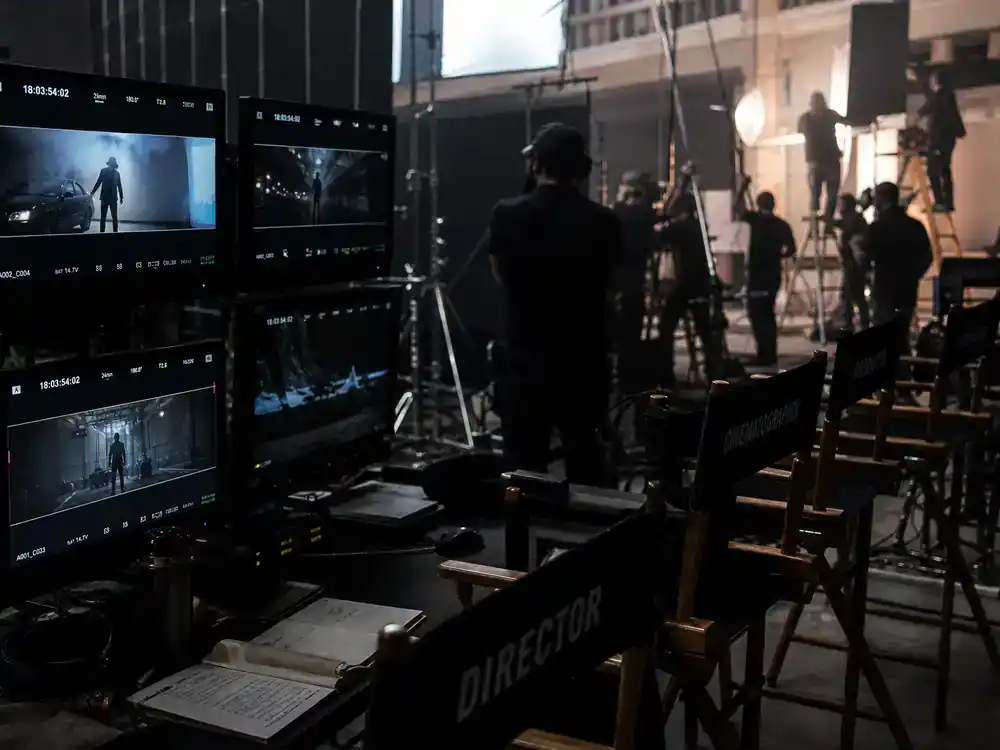 DC Universe 2026 movies and cast roadmap Lanterns series — TV production monitors and director chairs on streaming drama set, no identifiable faces