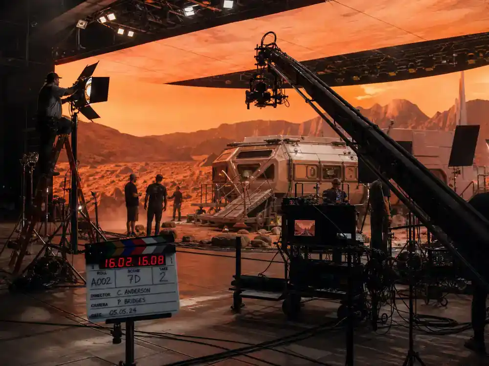 Dune Part Three filming updates and cast facts soundstage — premium sci-fi film set with camera boom LED volume screens and crew adjusting lighting on elaborate production build