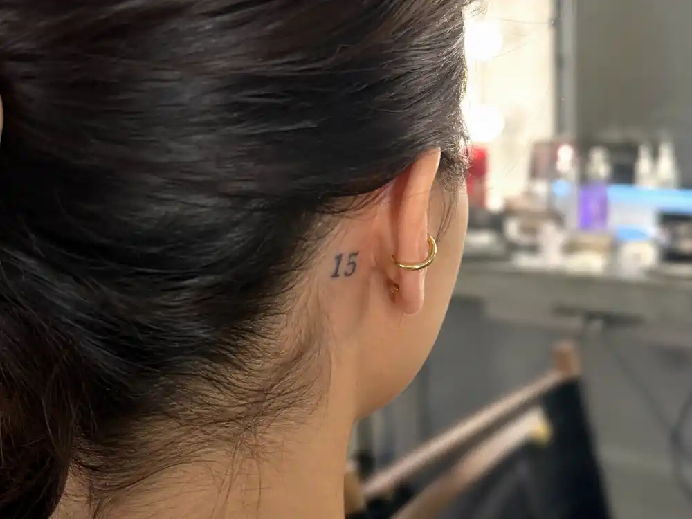 Evan Rachel Wood tattoos and their meanings 15 ear — number 15 behind ear matching tattoo with Marilyn Manson