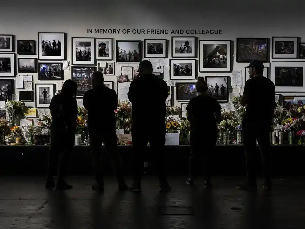 Fast and Furious cast net worth 2026 ranked Paul Walker legacy — memorial tribute wall on studio lot with production stills and respectful crew silhouettes