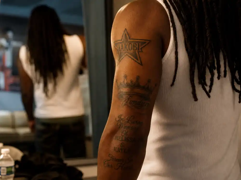 Future tattoos and their meanings — JAKOBI star and Londyn crown memorial name tattoos on forearm and elbow