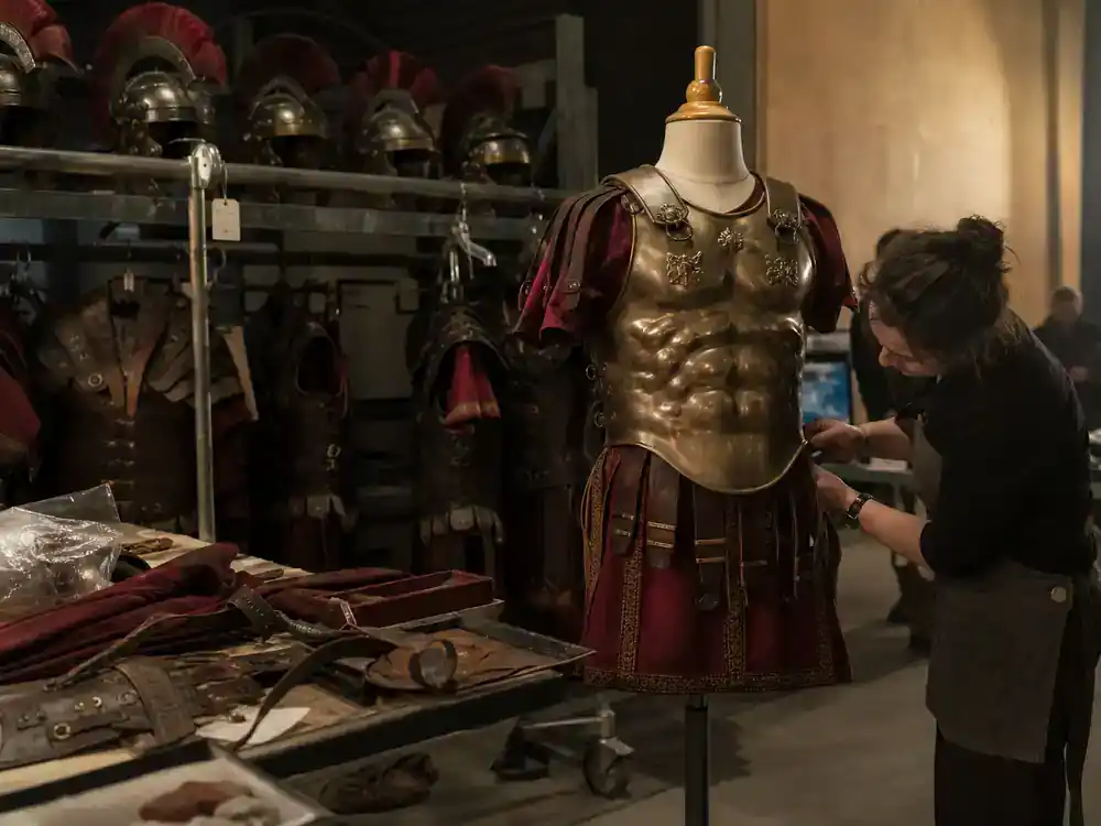 Gladiator 2 behind the scenes cast facts Pedro Pascal Marcus Acacius — Roman military armor racks and costume department fitting mannequins on set