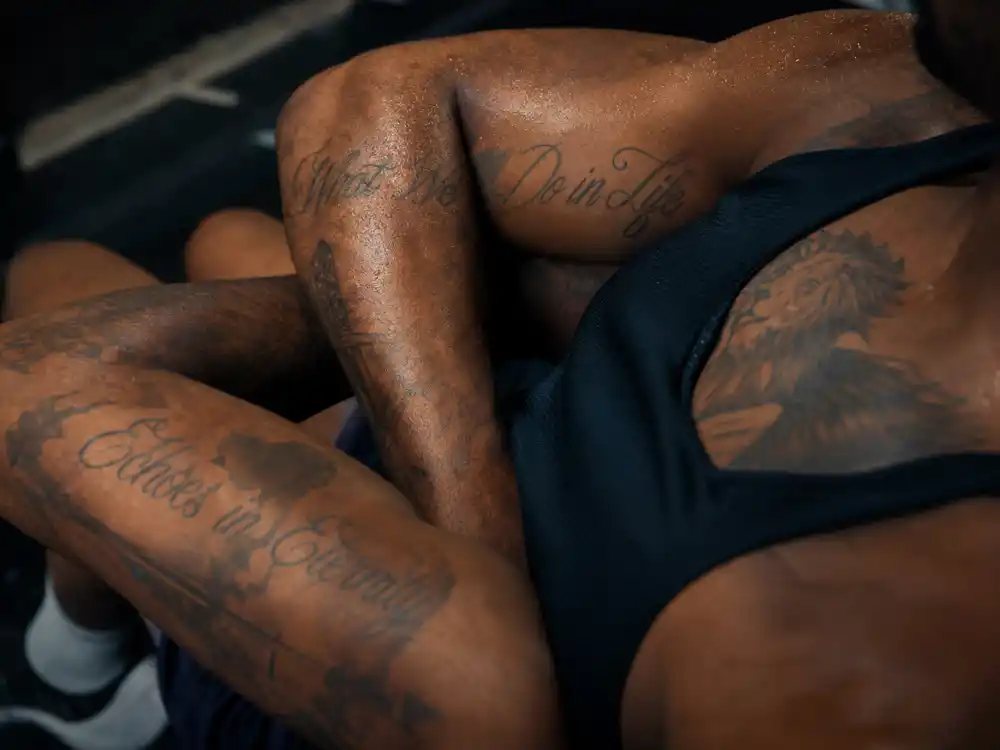 LeBron James tattoos and their meanings — What We Do in Life and Echoes in Eternity Gladiator quote arm tattoos