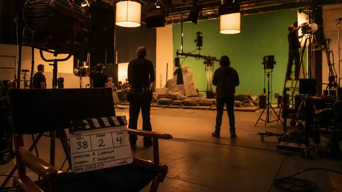 Marvel Cinematic Universe phase 6 movies cast guide — blockbuster superhero film crew on soundstage with clapperboard and director chairs, editorial production reference