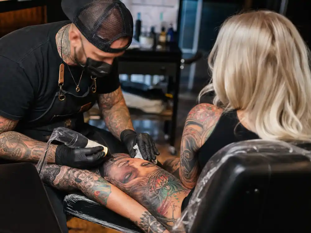 Odell Beckham Jr tattoos and their meanings — Joaquin Ganga tattoo artist session on leg portrait sleeve from behind