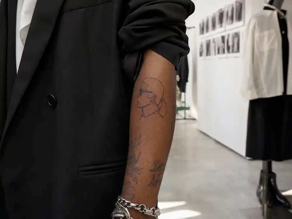Playboi Carti tattoos and their meanings — Virgil Abloh Met Gala outline tribute forearm tattoo in fashion showroom