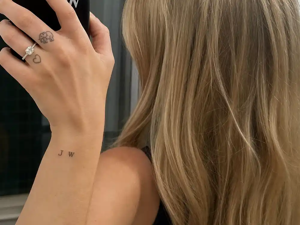 Sophie Turner tattoos and their meanings J and W initials — tiny wrist tattoos for husband Joe Jonas and daughter Willa in fine black ink