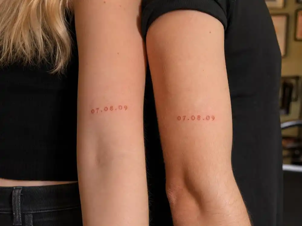 Sophie Turner tattoos and their meanings GOT casting date — matching 07.08.09 peach ink on inner forearm with Maisie Williams