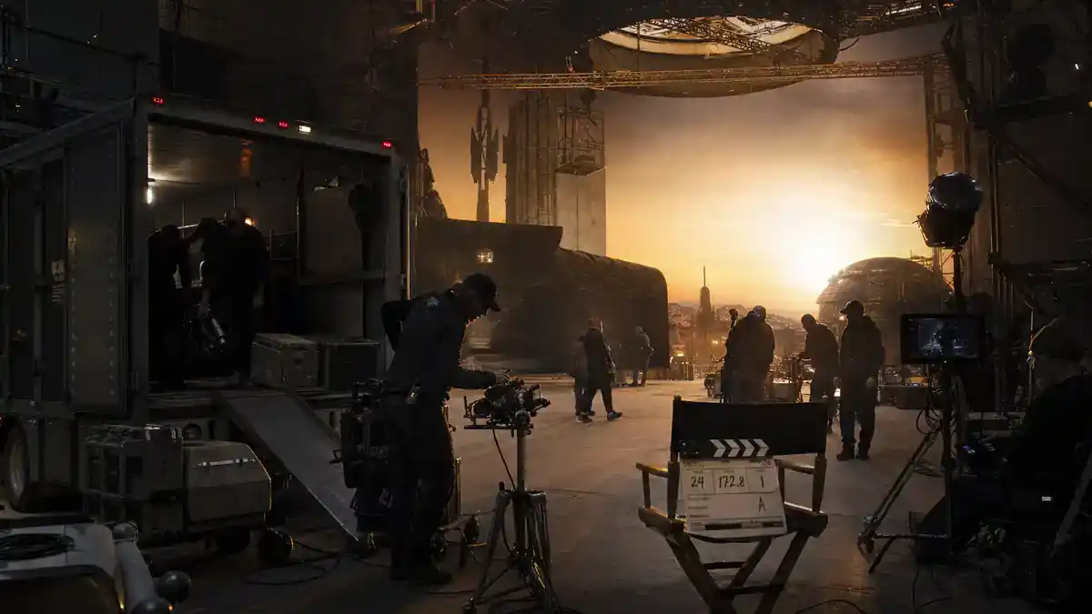 Star Wars upcoming movies and cast guide — blockbuster sci-fi film set at dawn with crew silhouettes, clapperboard, and director chairs, editorial production reference