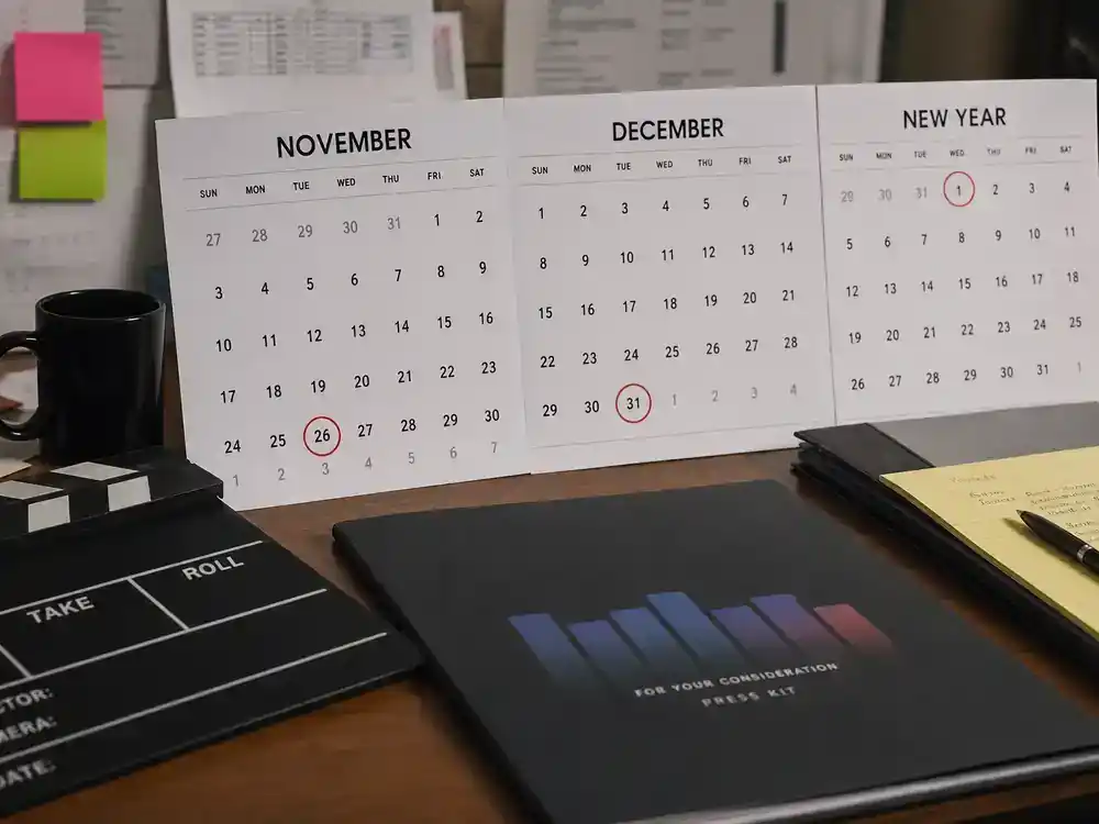 Stranger Things season 5 cast and characters guide release schedule — production office calendar with November and December dates circled, clapperboard on desk