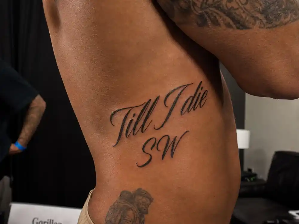 Tom Hardy tattoos and their meanings — Till I die SW stomach script tribute to ex-wife Sarah Ward
