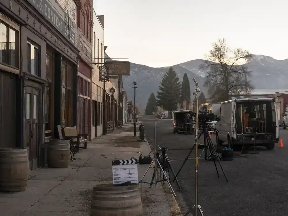 Yellowstone filming locations Montana guide Darby Montana — small mountain town main street TV location filming with camera crew and production vans at dawn