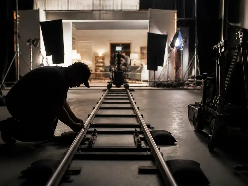 Camera dolly track on a soundstage, a production milestone in Angelina Jolie net worth over the years