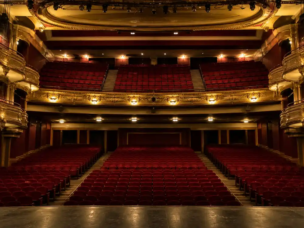 Empty theater velvet seats from stage, the nine-year Park MGM residency engine in Bruno Mars net worth 2026