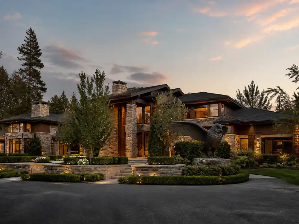 Luxury estate exterior at dusk tied to Drake net worth 2026 property holdings