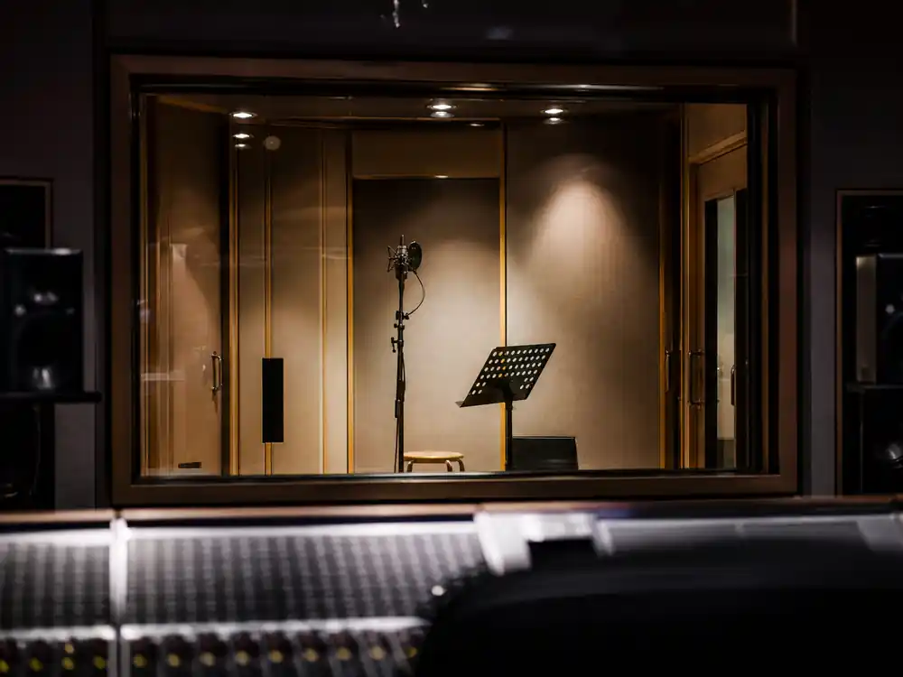 Recording booth through control-room glass for Drake net worth 2026 catalog royalties