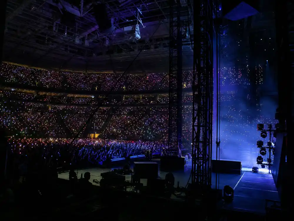 Sold-out arena from stage wing for how Drake makes money touring valve