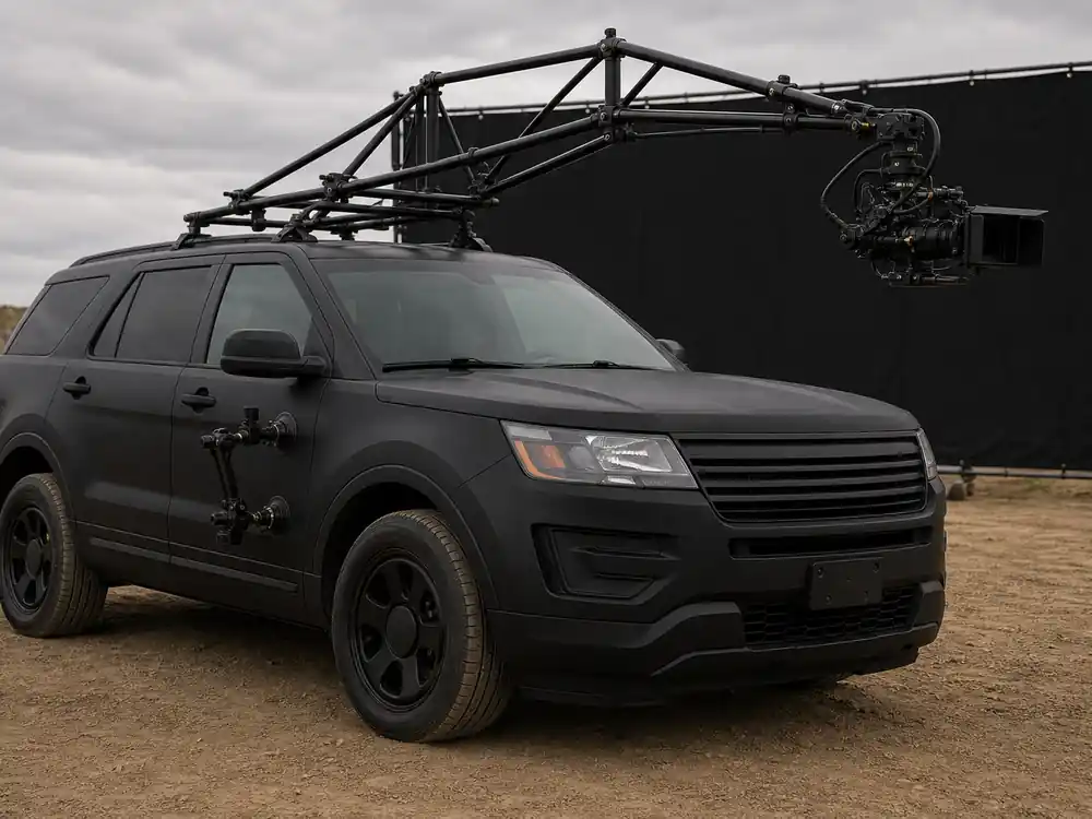 Empty de-badged stunt camera car on set showing how Dwayne Johnson makes money from action film production