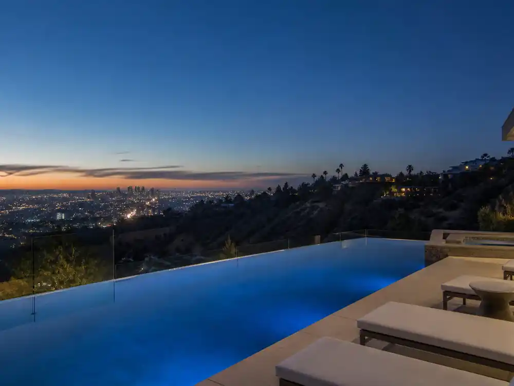 Infinity pool terrace overlooking Los Angeles at dusk for richest actors in Hollywood 2026 luxury estates